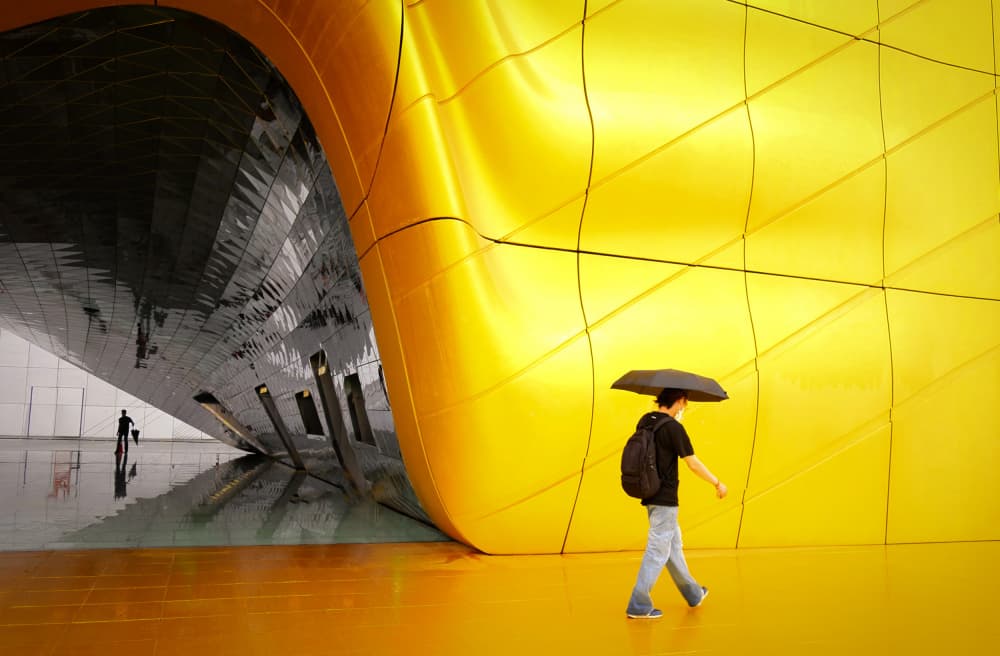 Man Walking Golden Architecture by Mi Young Choi — canvas wall art