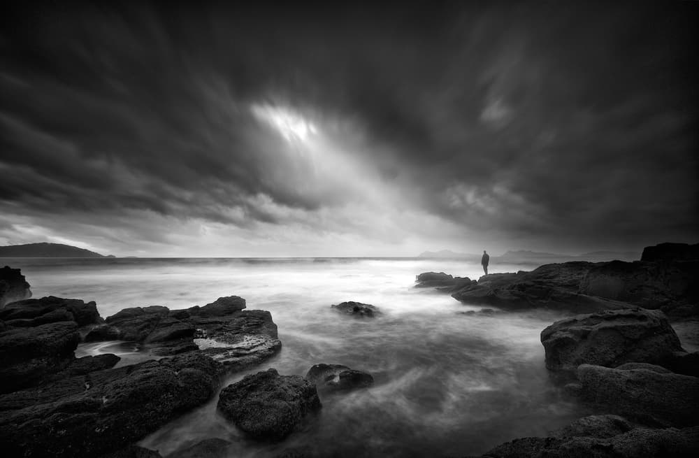 Solitary Figure Stormy Coast by Santiago Pascual Buye — canvas wall art