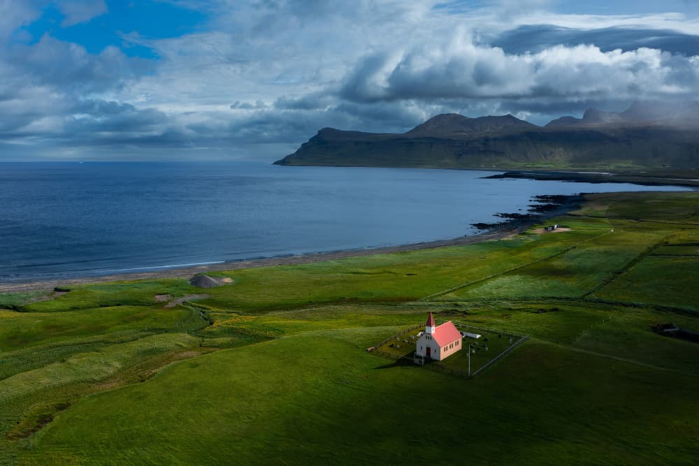 Icelandic Coastline Church by Jure Kravanja — canvas wall art