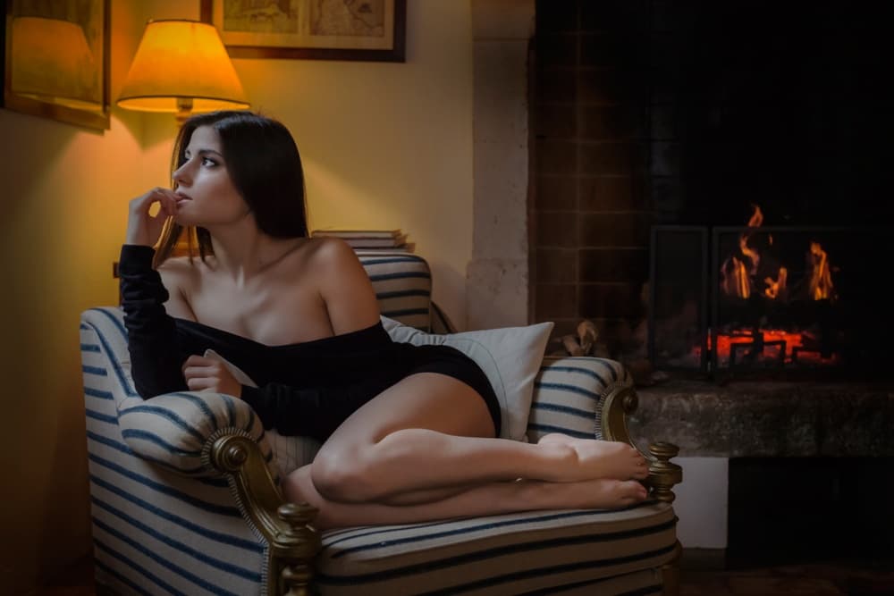 Cozy Fireside Woman by Fabrizio Micheli — canvas wall art