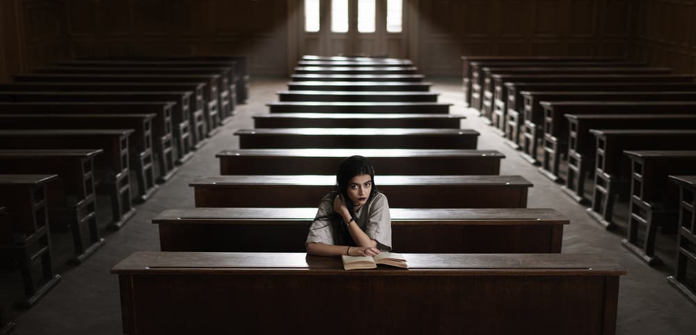 Focused Student in Lecture Hall by Bobby Kostadinov — canvas wall art