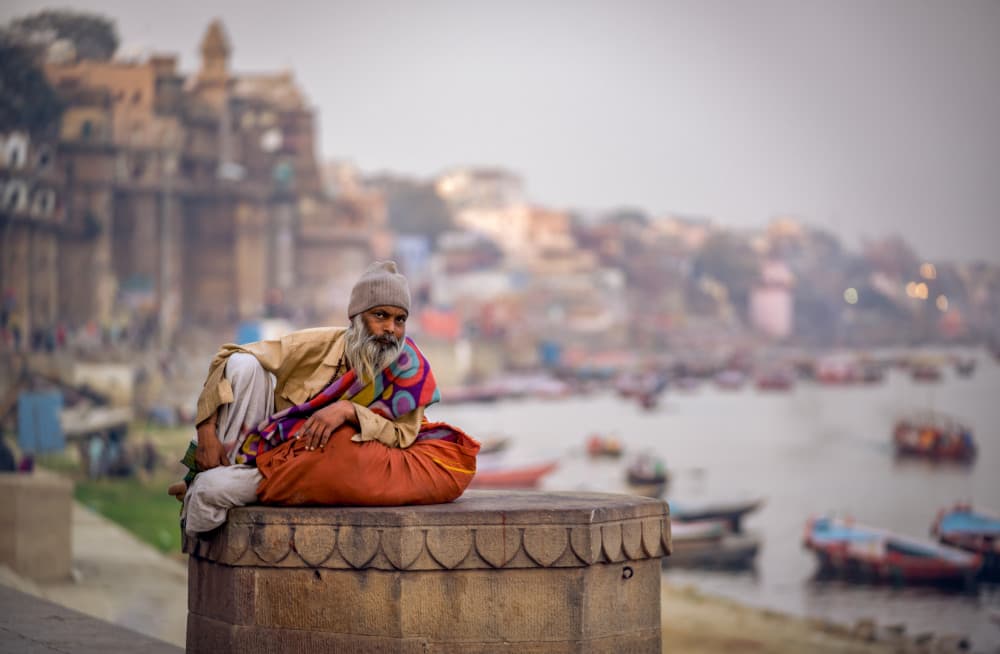 Contemplative Man on Ganges by Ludwig Riml — canvas wall art