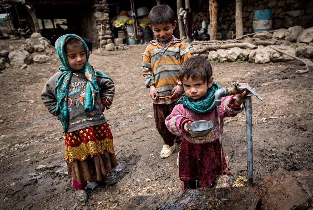 Young Children Collecting Water by Mohammadreza Momeni — canvas wall art