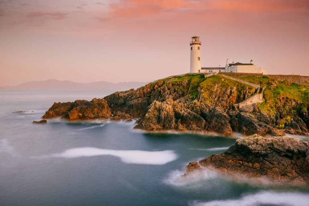 Pink Sky Lighthouse by Adrian Popan — canvas wall art