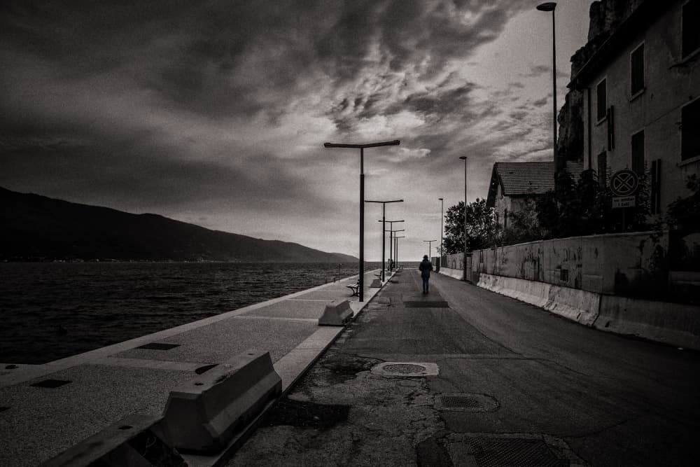 Solitary Waterfront Walk by Hans Günther — canvas wall art