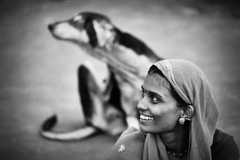 Smiling Woman and Calf by Stefan Nielsen — canvas wall art