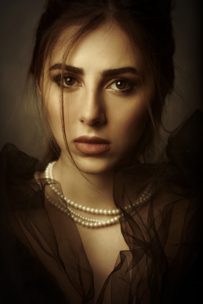 Pensive Woman With Pearls by Mehdi Mokhtari — canvas wall art