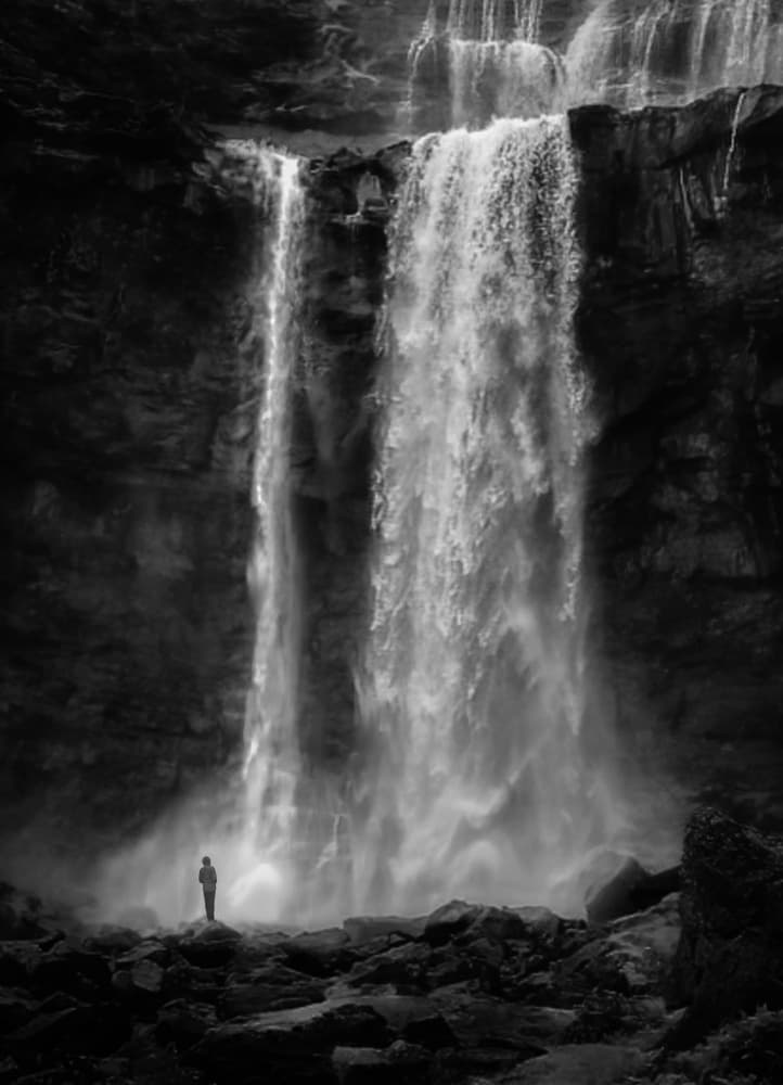 Man at Grand Waterfall by Kenneth-Wei Zeng — canvas wall art