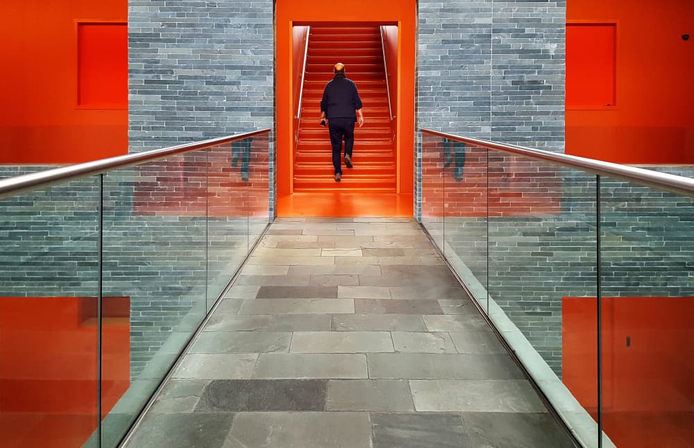 Vibrant Orange Stairway by Huib Limberg — canvas wall art