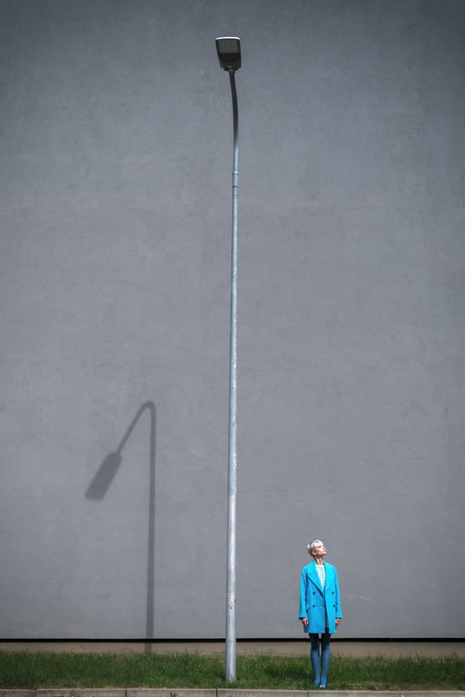 Woman in Blue Coat by Piotr Wrobel — canvas wall art