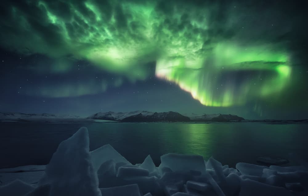 Aurora Over Icy Waters by Carlos F. Turienzo — canvas wall art