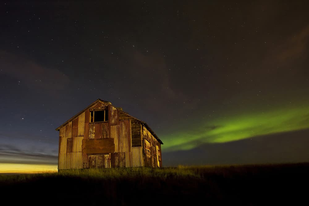 Aurora Over Rustic Barn by Þorsteinn H. Ingibergsson — canvas wall art