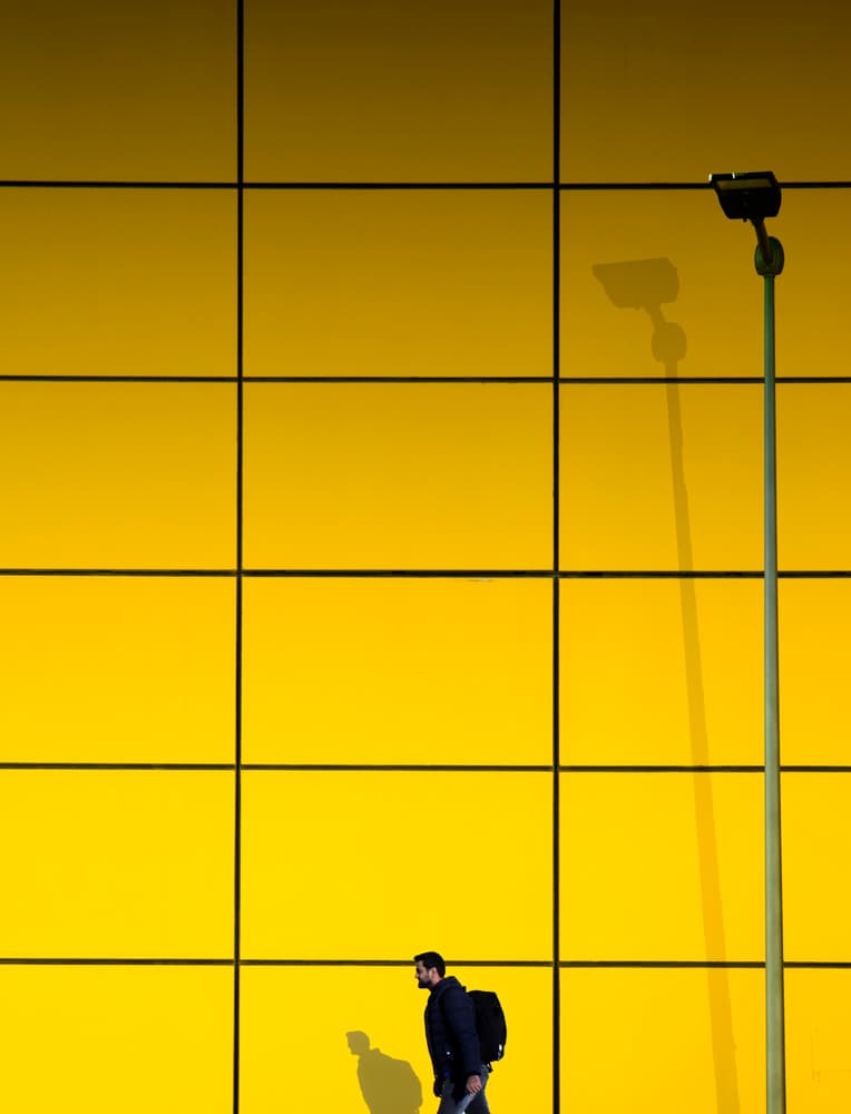 Man Against Yellow Grid by Ibrahim Nabeel — canvas wall art