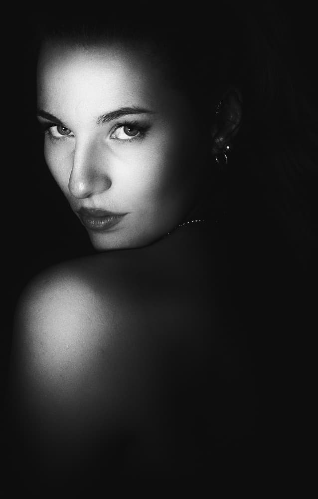 Elegant Woman Dark Gaze by Toni Fidanza — canvas wall art