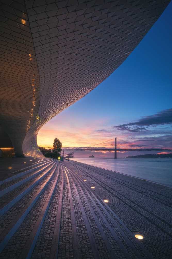Curved Building Sunset by Jean Claude Castor — canvas wall art