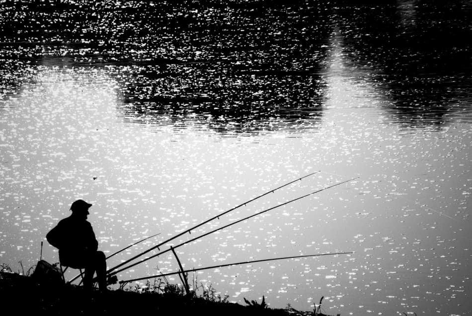Solitary Fisherman Silhouette by Codrin Lupei — canvas wall art