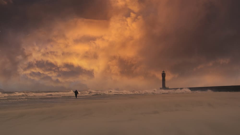 Lighthouse Under Orange Sky by Stéphane Pecqueux — canvas wall art