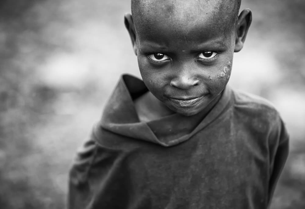 African Boy Intense Gaze by Goran Jovic — canvas wall art