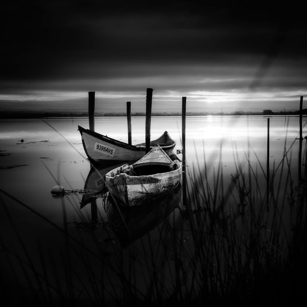 Moody Boats Still Water by Marco Faria — canvas wall art