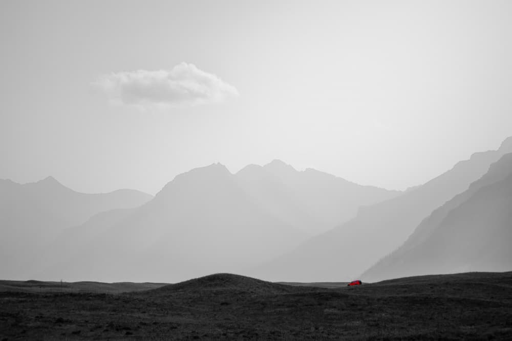 Red Car Among Mountains by Alex Zhao — canvas wall art