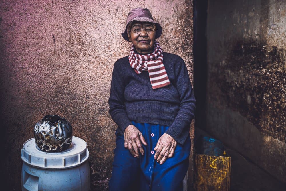Smiling Elder Woman by Marco Tagliarino — canvas wall art