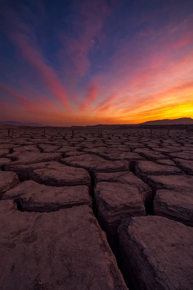 Vibrant Cracked Earth Sunset by Arie Burla — canvas wall art