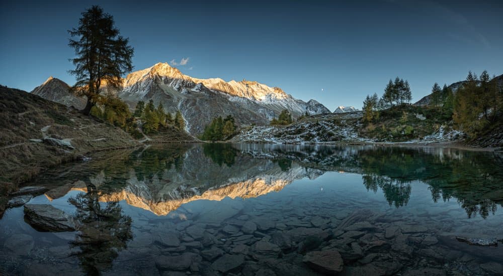 Serene Alpine Lake Reflection by April Xie — canvas wall art