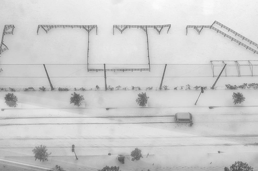 Snowy Winter Street View by Tomoshi Hara — canvas wall art