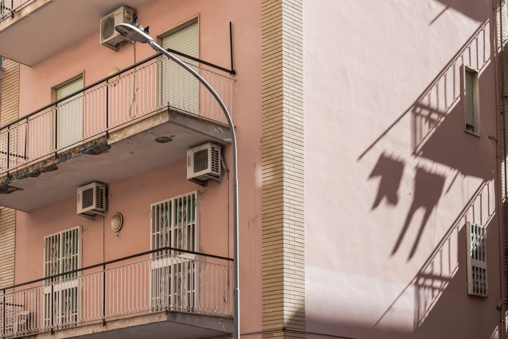 Pink Building Shadows by Photolovers — canvas wall art