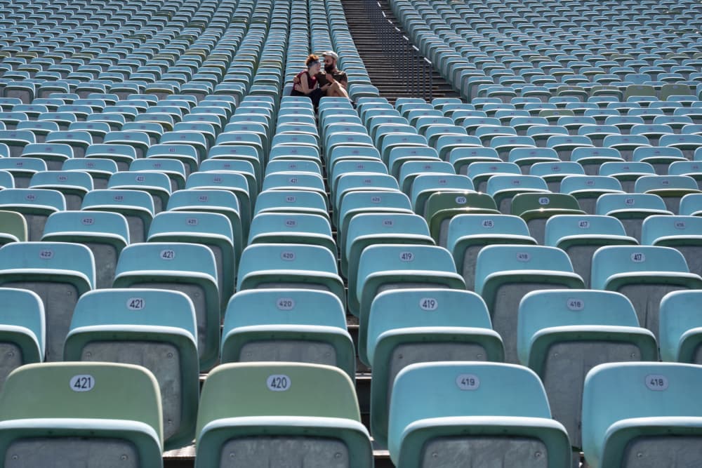 Couple In Empty Stadium by FranzStaab — canvas wall art