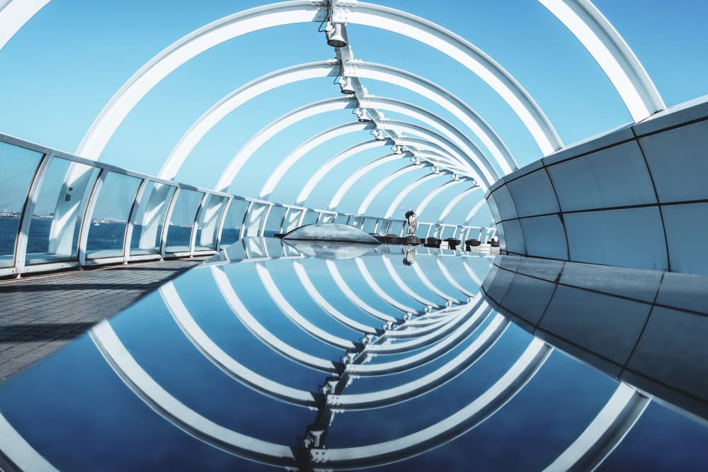 Blue Sky Tunnel Reflection by Tomoshi Hara — canvas wall art