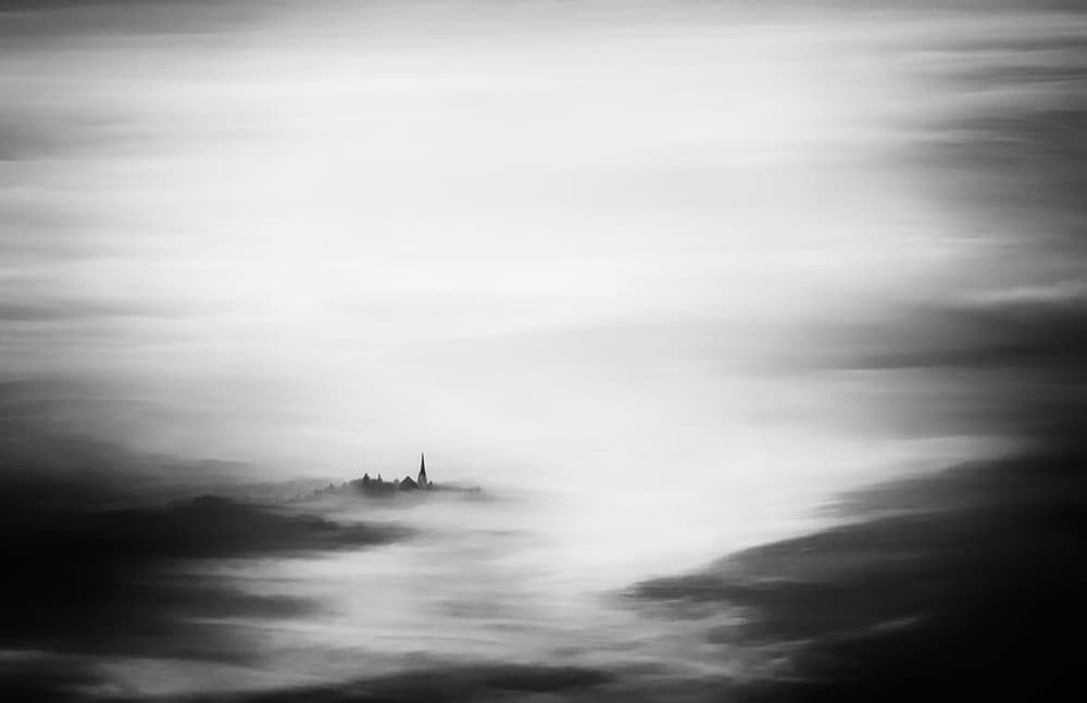 Misty Village Steeple by Ales Komovec — canvas wall art