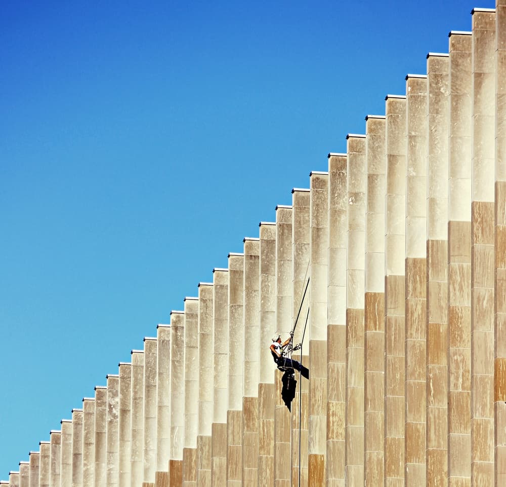 High Rise Facade Worker by Jian Wang — canvas wall art