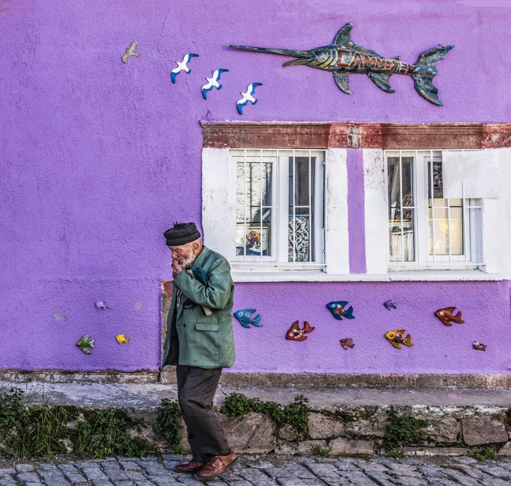 Old Man By Purple Wall by Ömer Ates Kızıltug — canvas wall art
