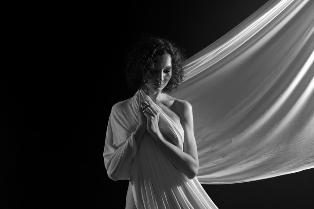 Serene Woman in Fabric by Yoram GIL — canvas wall art