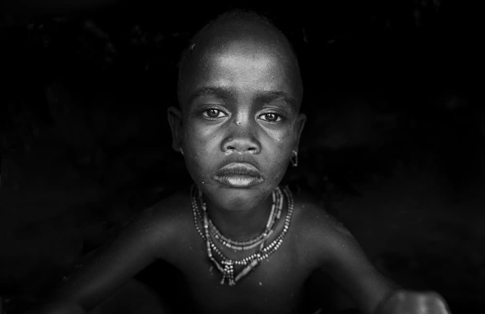 Child's Deep Gaze by Sarawut Intarob — canvas wall art