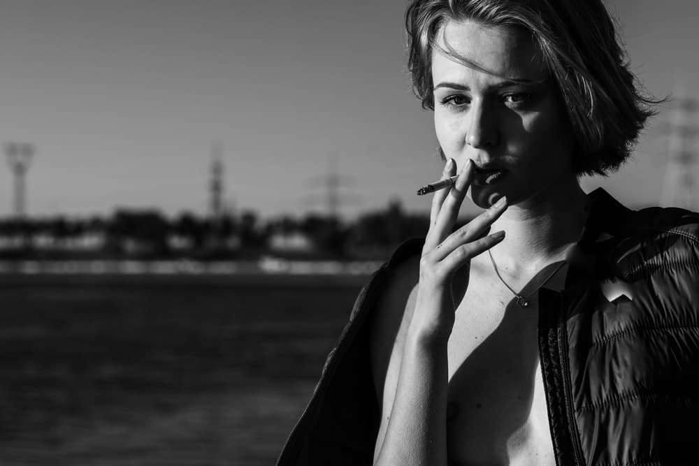 Pensive Woman Smoking by Thanakorn Chai Telan — canvas wall art
