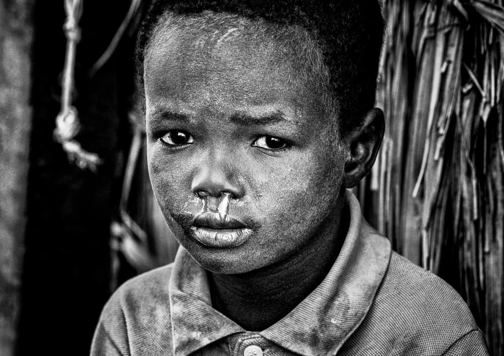 African Boy's Gaze by Joxe Inazio Kuesta Garmendia — canvas wall art