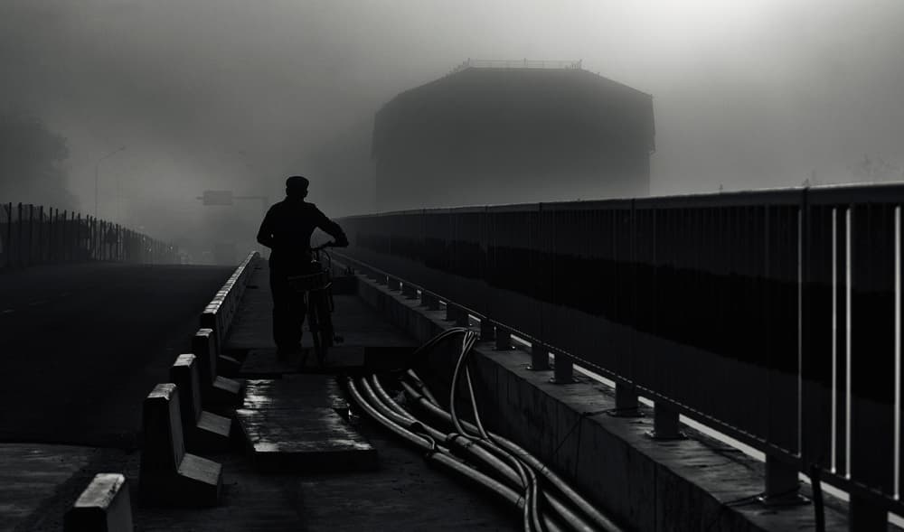 Man On Foggy Bridge by Julien Oncete — canvas wall art