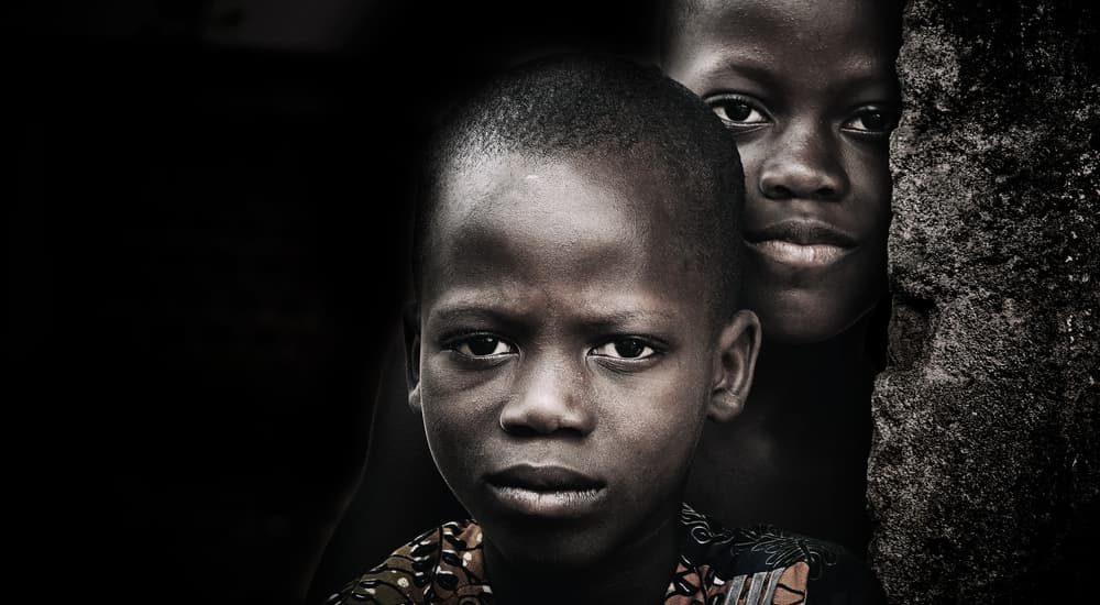 African Boys' Gaze by Elena Molina — canvas wall art