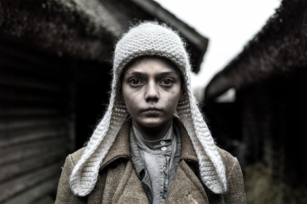 Child's Solemn Gaze by Waldemar Szmidt — canvas wall art