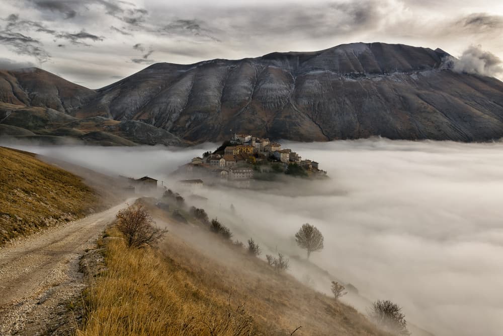 Misty Mountain Village by Riccardo Lucidi — canvas wall art