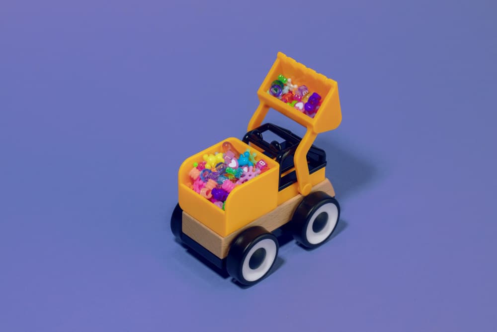Yellow Loader Full Of Beads by Julia Ramiro — canvas wall art