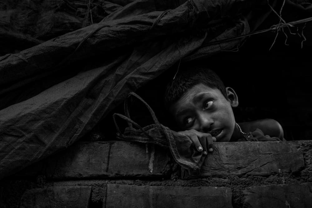 Young Boy Looking Up by Kuntal Biswas — canvas wall art