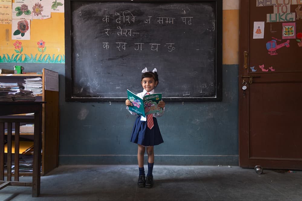 Happy School Girl Reading by Haitham AL Farsi — canvas wall art