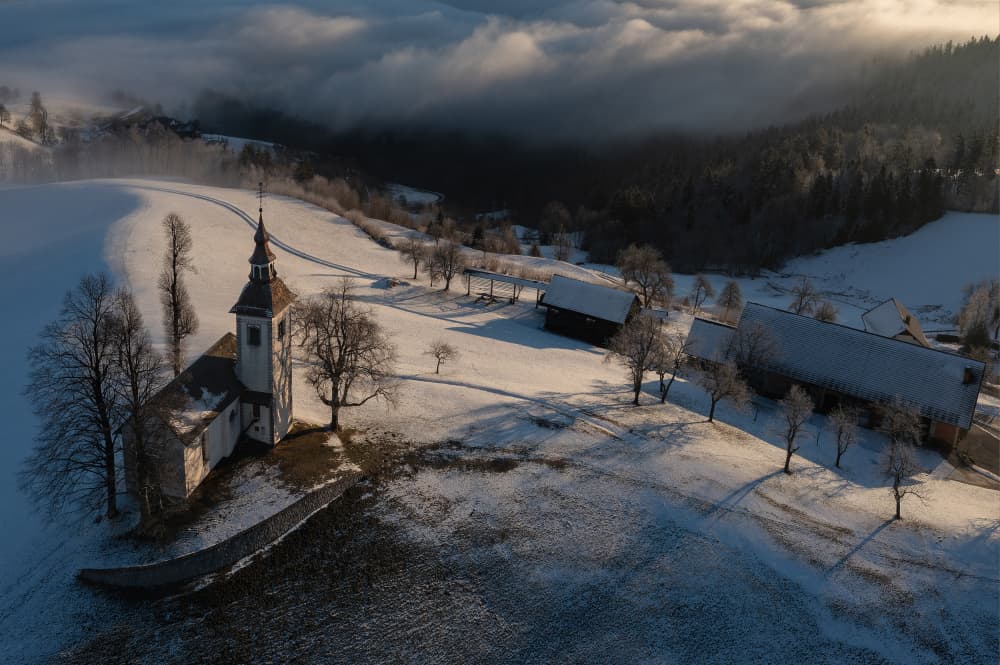 Snowy Mountain Church Village by Jure Kravanja — canvas wall art