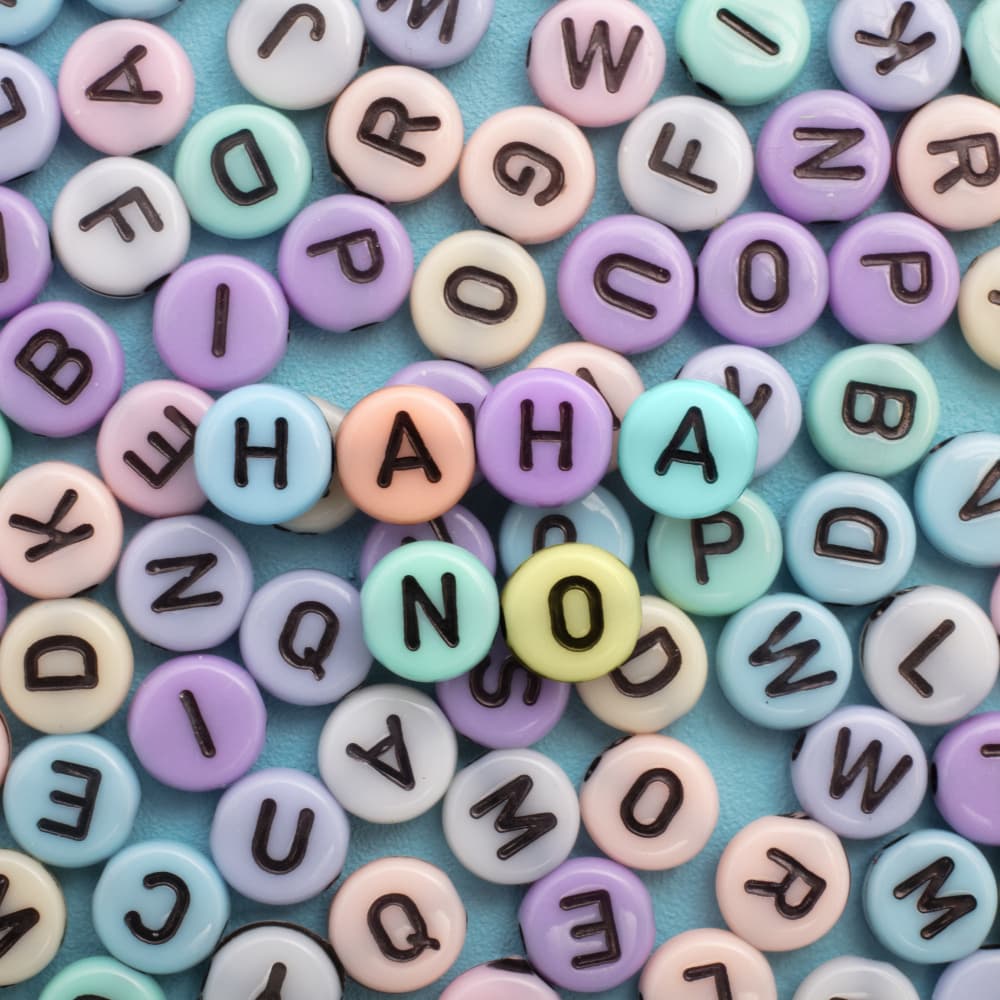 Playful Letter Beads by Julia Ramiro — canvas wall art