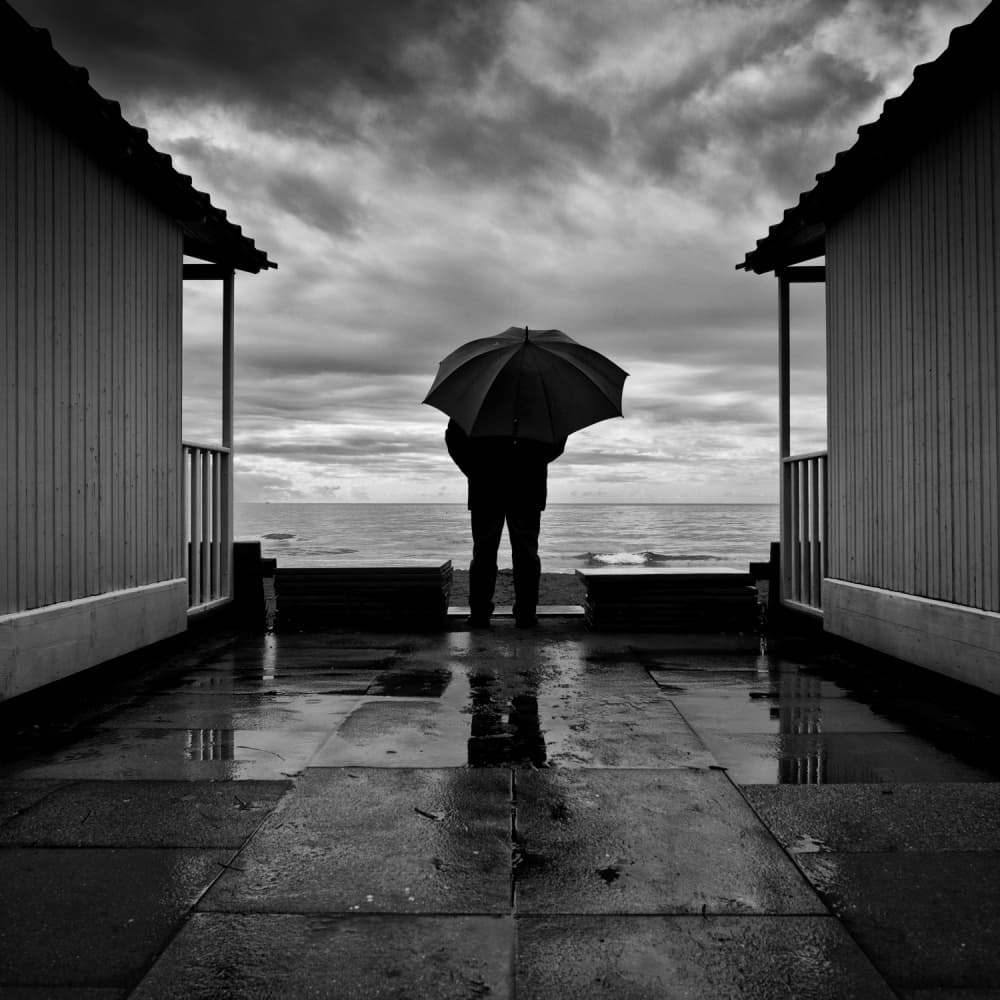 Umbrella By Stormy Sea by Massimo Della Latta — canvas wall art