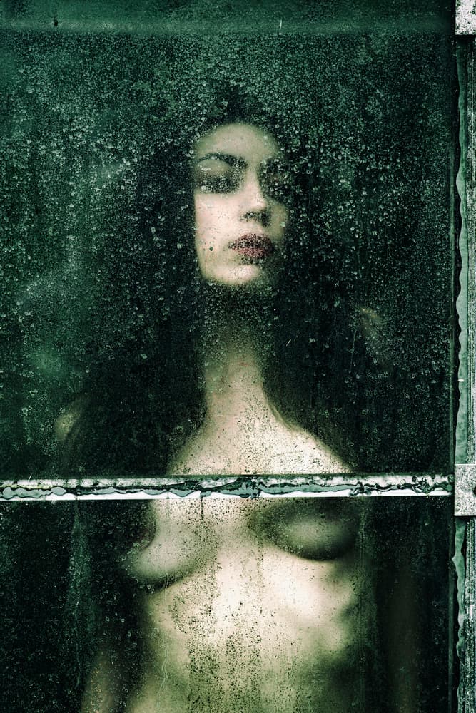 Woman Behind Wet Glass by Jacob Tuinenga — canvas wall art