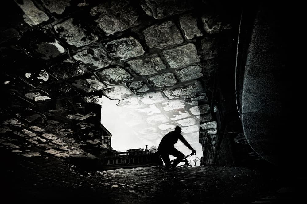 Urban Cyclist Shadow by Antonio Grambone — canvas wall art